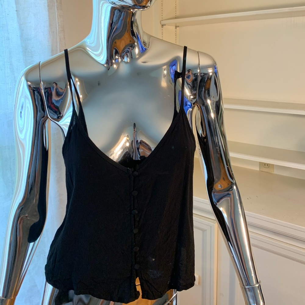 Sleeveless black top with buttons